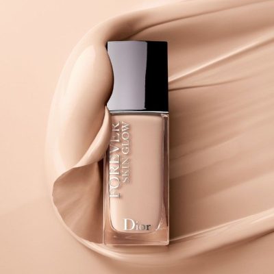 Dior Forever Skin Glow radiant foundation bottle with a silver cap on a clean background.