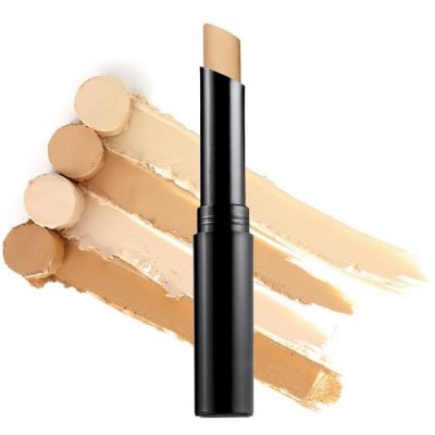 Close-up of liquid concealer tube with applicator on a warm beige aesthetic background.