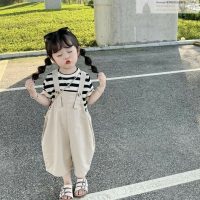 trendy, casual-outfit Little girl wearing a cute top and skirt outfit for a trendy casual outdoor look